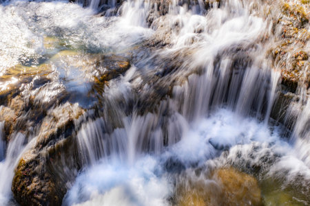 long exposure in a small waterfall in a mountain river of fresh and pure waters, mountain snowmelt...