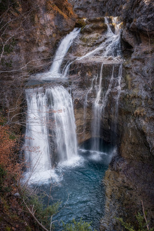 waterfall the Cave in the heart of the National Park of Ordesa and Monte Perdido, set in a rocky...