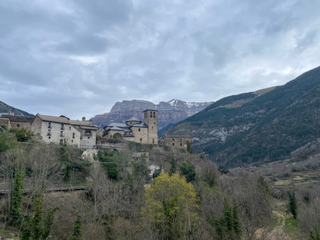 small village of Torla, gateway to the Ordesa y Monte Perdido National Park in the Spanish Pyrenees, Aragon, Spain, San Salvador Church, horizontalの写真素材