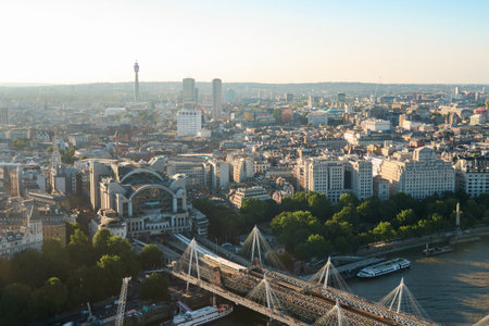 drone view of Charing Cross railway station and Hungerford bridge with the city of London in the...