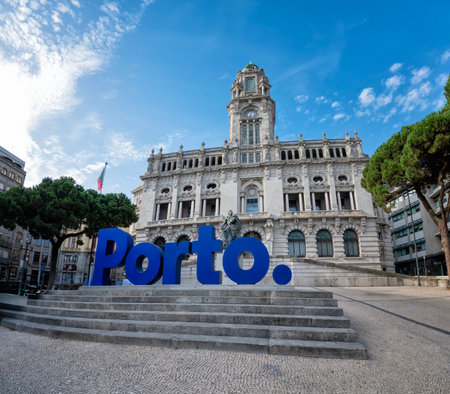 View of Porto City Hall with the iconic blue Porto sign in the foreground, located in Liberdade Square, under a bright blue sky in Portugalの写真素材