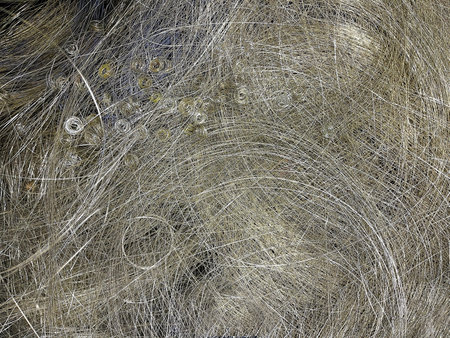 Abstract background of tangled silver metallic wires and thin steel threads. Intricate industrial...