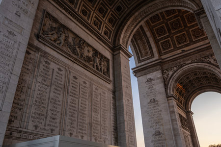Low angle architectural detail of the interior of the arc de triomphe in paris showing intricate...