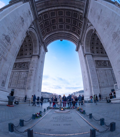 Paris, France; December 29 2026: Fisheye view of the tomb of the unknown soldier under the arc de...