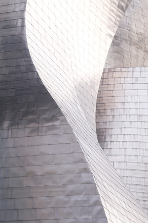 BILBAO, SPAIN - MAY 26, 2016: Detail at the sunset of the titanium plates cover That the Guggenheim Bilbao Museum. This Museum is dedicated exhibition of modern art.のeditorial素材