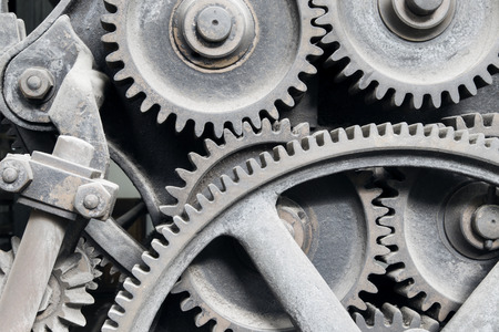 Old machinery: gear, metal cogwheels, nuts and bolts. Everything is working fine since a lot of time...