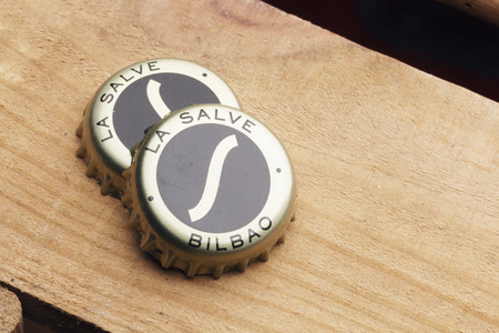 BILBAO, SPAIN - JANUARY 18, 2017. Two bottle caps of La Salve original beer. La Salve is a spanish beer brand, established in the city of Bilbao in 1886.のeditorial素材
