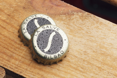 BILBAO, SPAIN - JANUARY 18, 2017. Two bottle caps of La Salve original beer. La Salve is a spanish beer brand, established in the city of Bilbao in 1886.のeditorial素材