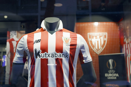 BILBAO, SPAIN - DECEMBER 23, 2017: Athletic Club soccer team shirt, taken outdoors on the storefront of the club shop.のeditorial素材