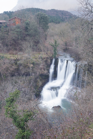 Waterfall of Penaladros in Cozuela, Burgos, Spain. On a cloudy day of winter. Long exposure photography.の写真素材