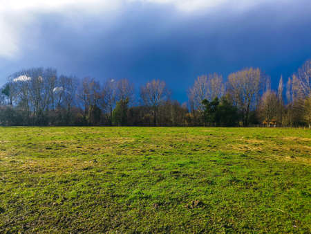 contrast of rain and green of the countrysideの写真素材