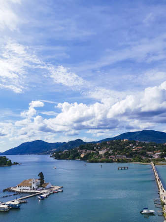 white church, houses, sea, nature and skyの写真素材