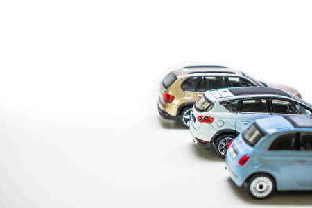 Toy cars on a white background. Toy cars in a row.の写真素材