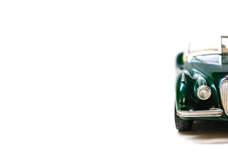 Classic green toy car isolated on white background with copy space for your textの写真素材
