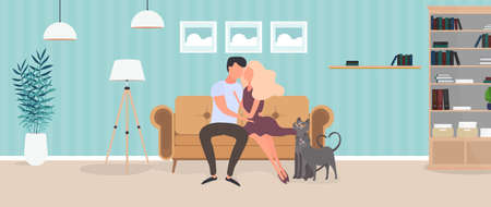 Loving couple sitting on the sofa in the room. Lovers hug each other. Suitable for the design of cards, banners and posters on the theme of love and Valentine's Day. Vector.のイラスト素材