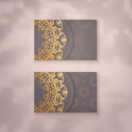 Presentable business card in brown color with mandala gold pattern for your personality.のイラスト素材