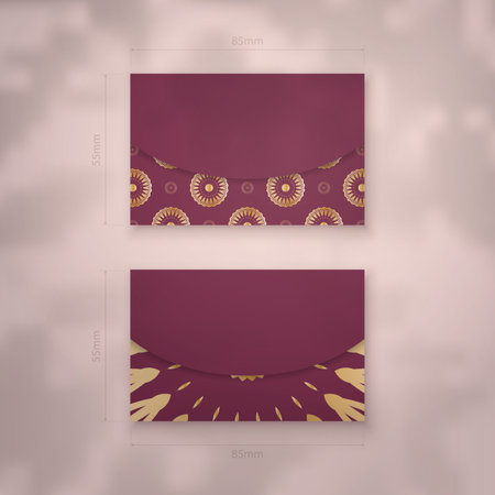 Business card in burgundy color with vintage gold pattern for your brand.のイラスト素材