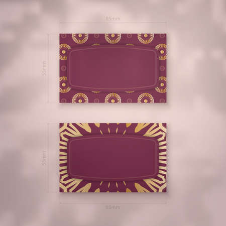 Visiting business card in burgundy color with vintage gold ornaments for your business.のイラスト素材