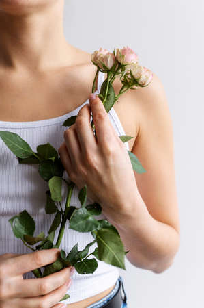 Hand holding elegant flowerの写真素材