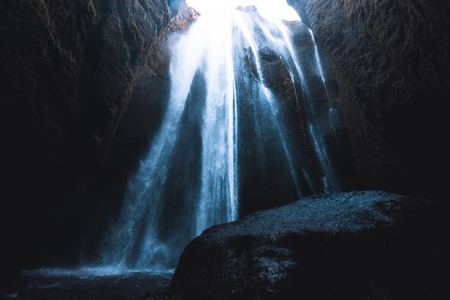 Gljufrafoss waterfall, which is almost completely hidden behind a cliff face, Icelandの写真素材