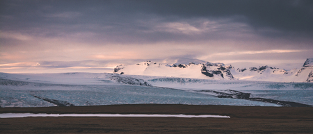 Jokulsarlon, glacier lagoon in Iceland at night with ice floating in water. Cold arctic nature landscape scenery. Ice melting.の写真素材