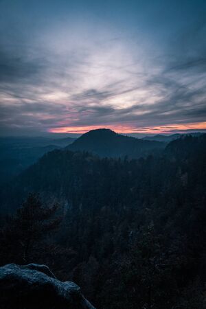 Sun breaking through after a storm on an autumn afternoon over Jetrichovice, beautiful landscape, Bohemian Switzerland, Czech Republicの写真素材