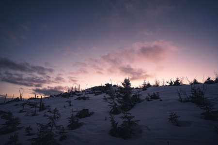 Majestic winter landscape glowing by sunlight in the morning. Dramatic wintry scene. Jetrichovice, Czech Republicの写真素材