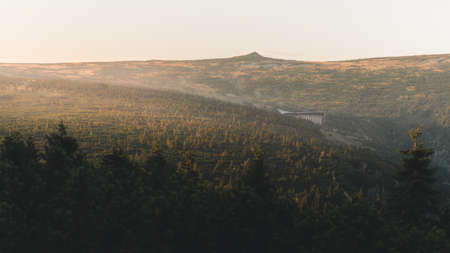 Spring hilly landscape at sunset time. Colorful trees and meadows. View of Krkonose, Pancavske vodopady, Czech Republicの写真素材