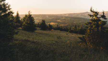 Spring hilly landscape at sunset time. Colorful trees and meadows. View of Krkonose, Pancavske vodopady, Czech Republicの写真素材