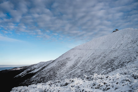 Winter mountain landscape with blue cloudy sky, Krkonose, Czech Republicの写真素材