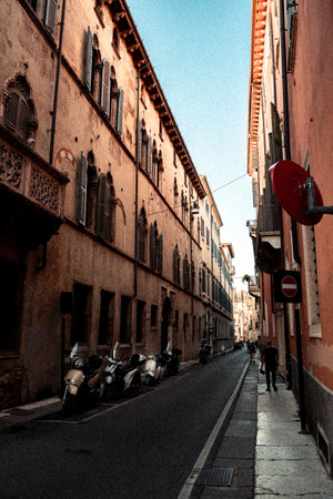 There exists a narrow street that features a prominent red no entry sign, clearly indicating restricted access to vehicles or trafficの写真素材