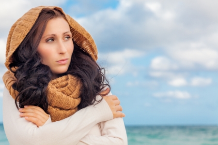 embracing outdoor female on beachの写真素材