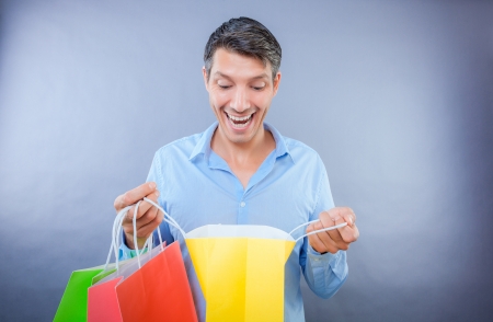 happy male laughing smiling shop surpriseの写真素材