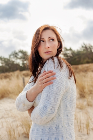 carefree autumn spring female on coastの写真素材