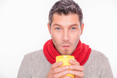 man blowing tea warming up colder seasonの写真素材