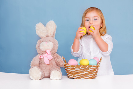 sweet little easter girl with eggs
