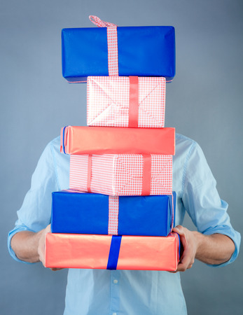 holding a lot of gifts for the familyの写真素材