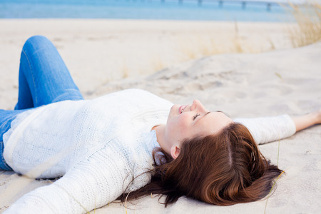 relaxing with the sun in the neck carefree coastsideの写真素材