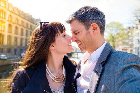 tourist walking couple through cityの写真素材