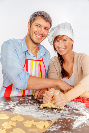 backing sweets for christmas coupleの写真素材