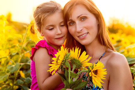 mother with daughter in the summerendの写真素材