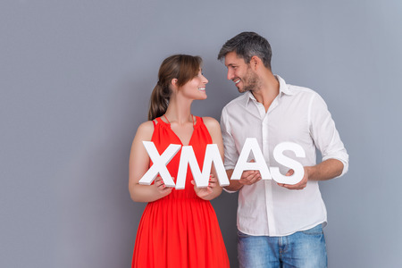 couple holding cristmas lettersの写真素材