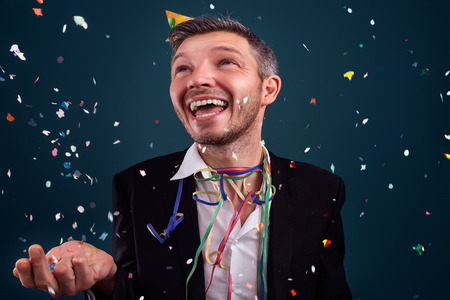 happy man in confetti rain