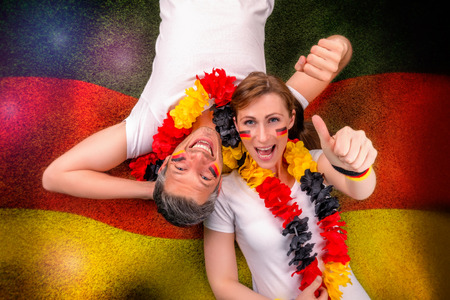 german couple going for goalの写真素材