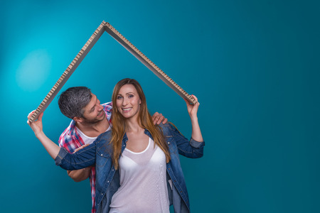 couple embracing holding concept roofの写真素材