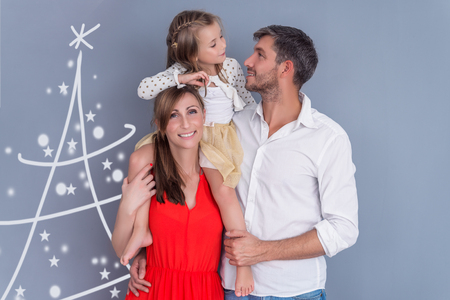 christmas daughter with parents portraitの写真素材