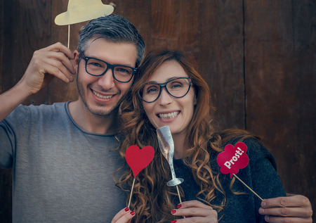 hipster couple of girlfriend and bpyfriend holding heartの写真素材