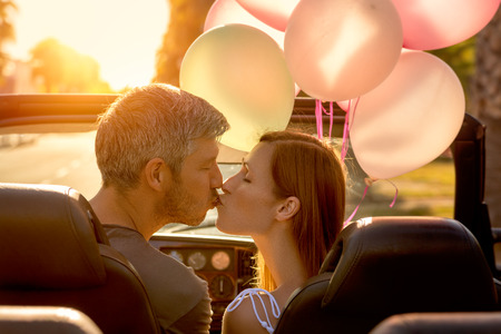 couple summer car trip couple in sunsetの写真素材
