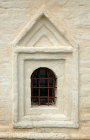 The whitewashed brick wall with window of a monastery in the city of Suzdal, Russiaの写真素材