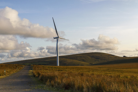 One Wind Turbine at dusk with an access road